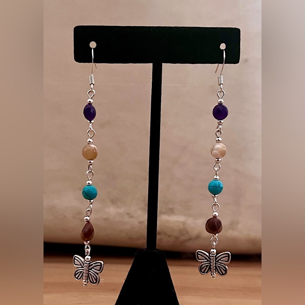 Silver plated, agate, howlite and cedar bead with butterfly charm.